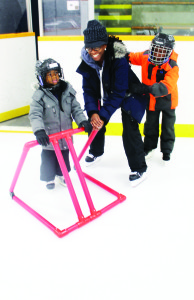 The Mayfield Recreation Comples was a busy place Sunday afternoon as the community was out for the 13th annual WinterFest. Suzette Campbell of SouthFields Village was helping her nephew Matteo Stewart, 4, try out skates for the first time, while her son Zane Stewart, 8, watched. Photos by Bill Rea