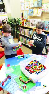 LIBRARY HAS A LEGO CLUB Benjamin Valleau, 6, of Brampton and Daniel Wadley, 7, of Inglewood were busy Saturday at the meeting of the Lego Club that is operating out of the Inglewood branch of Caledon Public Library. The club is scheduled to meet this coming Saturday (Jan. 21) and Jan. 28, from 10 to 11:30 a.m. Photo by Bill Rea