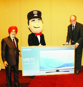 All the volunteers for HomeJames in the time leading up to the holidays were eligible to win this Samsung UHD TV, which was donated by Susan Carberry. HomeJames — Caledon Chairman Tayler Parnaby presented the prize to Bolton area resident Jasvir Dhaliwal.