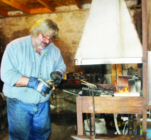Blacksmith George Church of Fergus was putting on demonstrations in the forge.