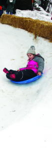 Despite the warm weather, there was still enough snow on the ground to let young folks get some sledding in. Bozhidara Stoeva, 5, from Mississauga got a ride down the Hill.
