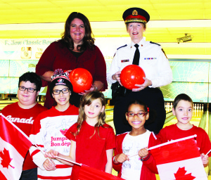 Big Brothers Big Sisters of Peel President and CEO Shari Lynn Ladanchuk is seen here with Peel Regional Police Chief Jennifer Evans, along with Little Brothers and Sisters Patrick, Alyssa, Emily, Adrianna and Cameron.