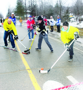 The weather last Saturday was unseasonably warm, putting a damper on the annual Alton Mill Pond Hockey Classic. But organizers were ready with Plan B, and players left the pond to take part in the grand Canadian custom of street hockey. “We had to roll with what came,” Alton Mill co-proprietor Jeremy Grant observed. Councillor Johanna Downey was sent on a break away by Inspector Ryan Carothers of Caledon OPP. Photos by Bill Rea