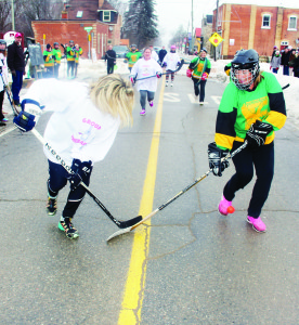 The first game in the tournament featured women going at it on the pavement. Group Therapy in the white jerseys, made up of women from Alton were taking on representatives from Erin Public School in green. The Alton side won 8-6.