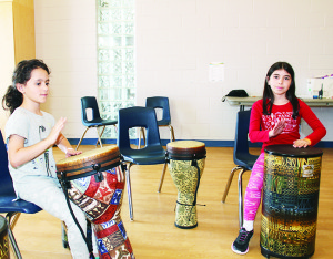 Marisa DeFrancesca, 8, and Melissa Aiello, 9, both of Bolton were having fun practising on the drums at CCRW.