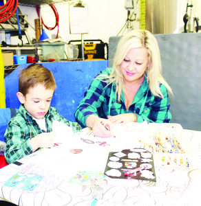 The Wassailing Festival featured a number of crafts for young people to work on. Stephanie Dobbin of Brampton was helping her son Carter, 3, with his.