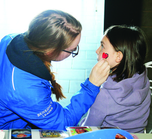 There was the chance for young folks to get their faces painted. Teen Ranch staff member Hannah Benedict was working on a design for Avery Carr, 7, of Georgetown.