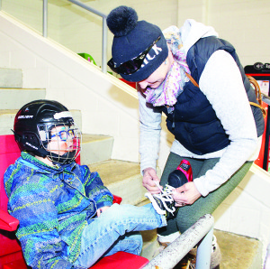 Some of the planned events at Teen Ranch on Highway 10 had to be canceled, but people were able to get in some skating. Orangeville area resident Amanda Davidson was helping tighten the skates for her son Shea, 4.