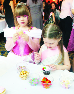 Reed Jarvis, 6, and Madelynn Doyle, 5, both of Richmond Hill, were hard at work decorating cup cakes.
