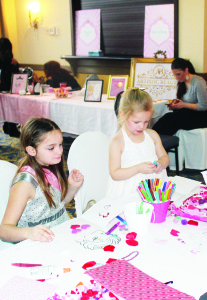 Elora Cote, 8, of Milton and her cousin Beth Masramieri, 3, of Georgetown, were making some heart creations.