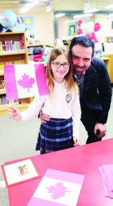 The crafts last month included making flags. Sarah Tassone, 9, of the Bolton area and her father Domenic were showing off the flag she put together.
