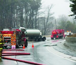 Crews were working in the rain Tuesday morning to deal with the fuel spill on Highway 9, east of Mono Mills. Photo by Bill Rea