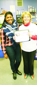Volunteer Renne Jackson presented an award to Janet Muir for raising the most money. She collected pledges for $1,932.