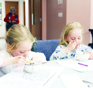 What's a pancake supper without a good dessert? Madeline Sutcliffe, 4, and her sister Beatrice, 5, were enjoying their desserts at the pancake supper at St. James' Anglican Church in Caledon East.
