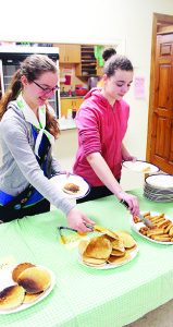 First Inglewood Pathfinders Johanna Figueroa and Kate Windross were helping to serve the diners at Knox United Church in Caledon village.