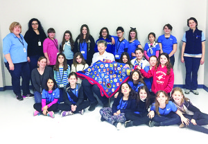 BEHARRIELL VISITS BOLTON GUIDES Lt. Col. (Ret'd) Susan Beharriell of King Township paid a visit to the 1st Bolton Girls Guides recently. She discussed her military career and challenges she faced and gave the girls some words of inspiration. She also engaged in some fun activities and brought her own Guiding memorabilia to share with the group. Photo by Kim Hesketh