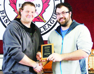 North Dufferin Baseball League Vice-President Tyler Linger presents Bolton's Michael Gemmiti with the award for best batting percentage at the league's annual awards banquet in Lisle Sunday. Photo by David Andersen, NDBL
