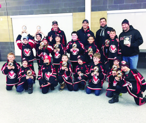NOVICE HAWKS WIN IN NIAGARA FALLS The Caledon Hawks Novice Rostered Select Team were the 2017 Ange Giajnorio Memorial Winter Thaw Tournament Champions in Niagara Falls. The Hawks won the final game 5-1 against Chedoke Express. All their hard work and determination allowed the Hawks to set the tone early by scoring the first goal in the first shift of each of the five games they played. The Hawks offensively out skated their opponents by putting up 16 goals while defensively shutting them down by only allowing three against. Seen here with their trophies are (back row) John Cheesman (trainer), Russ Sigler (assistant coach), Pino Agostino (head coach), Mark Prieur (assistant coach), (middle) Zenon Lipinski, Bryce Prieur, Ryker Skimming, Luca Lapiccirella, William Pankiw, Evan Sigler, Nevan Cegar, (front) Carter Hay, Kevin Rivait, Matteo Monaco, Braydon Searles, Myles Cheesman, Nicolas Bolognese, Nicolas Corsi and James Agostino.