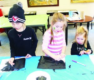 Library offered fun over March break Kids were off school last week, but Caledon Public Library held numerous events at various branches to help keep them occupied. Friday saw young folks working on northern lights painting at the Albion-Bolton branch. Jesse Moro, 8, of Bolton and Addison Haining, 6 of Orangeville were working on their creations while Addison's sister Genevieve, 2, watched. 