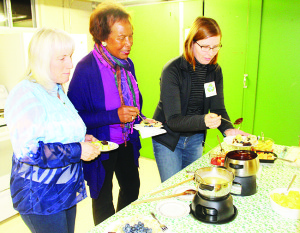 Brenda Lue, Stephanie Lanoue and Ann McRavie were lining up to sample some of the fondu