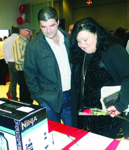 There were lots of interesting items available in the silent auction. John and Maria Ciufo of Bolton were looking them over.    Photos by Bill Rea