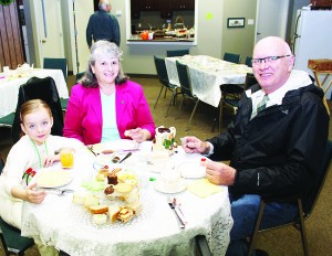 TEA TIME AT CHELTENHAM BAPTIST Cheltenham Baptist Church was decorated for St. Patrick's Day recently, just in time for the St. Patrick's Day Tea. Ella Vander Sluis joined her grandparents Barbara and Bob Vander Sluis, formerly of Inglewood, for tea. The event was a fundraiser for the renovations at the church. Photo by Bill Rea