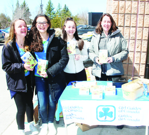 TIME TO BUY GIRL GUIDE COOKIES It that time of year again, when Girls Guides are out selling their delicious cookies. These members of the 1st Caledon East Pathfinders were out in front of the Foodland in Caledon East Saturday selling boxes of cookies to shoppers. Seen here are Crystal Tanton, Mikayla Lorini and Madison and Kelly Brownlee. Photo by Bill Rea
