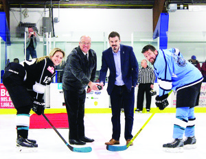 Mayor Allan Thompson and Tyler Puley, co-founder of Tealpower, handled the opening face-off at Saturday's match. The draw was between Rebecca Vint and Steve Conforti. Photo by Jake Courtepatte