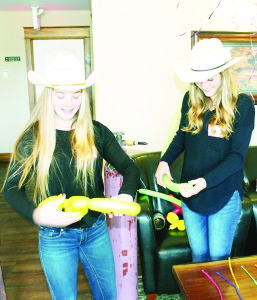 Volunteer Lauren Tutt and Teen Ranch staff member Elly Ensom were creating balloon sculptures.